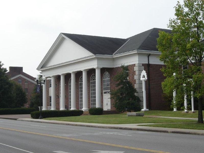 The Bryan Fine Arts builing is a brick building with white columns.